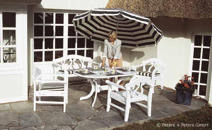 Wooden Garden Benches And Garden Furniture Painted White In A